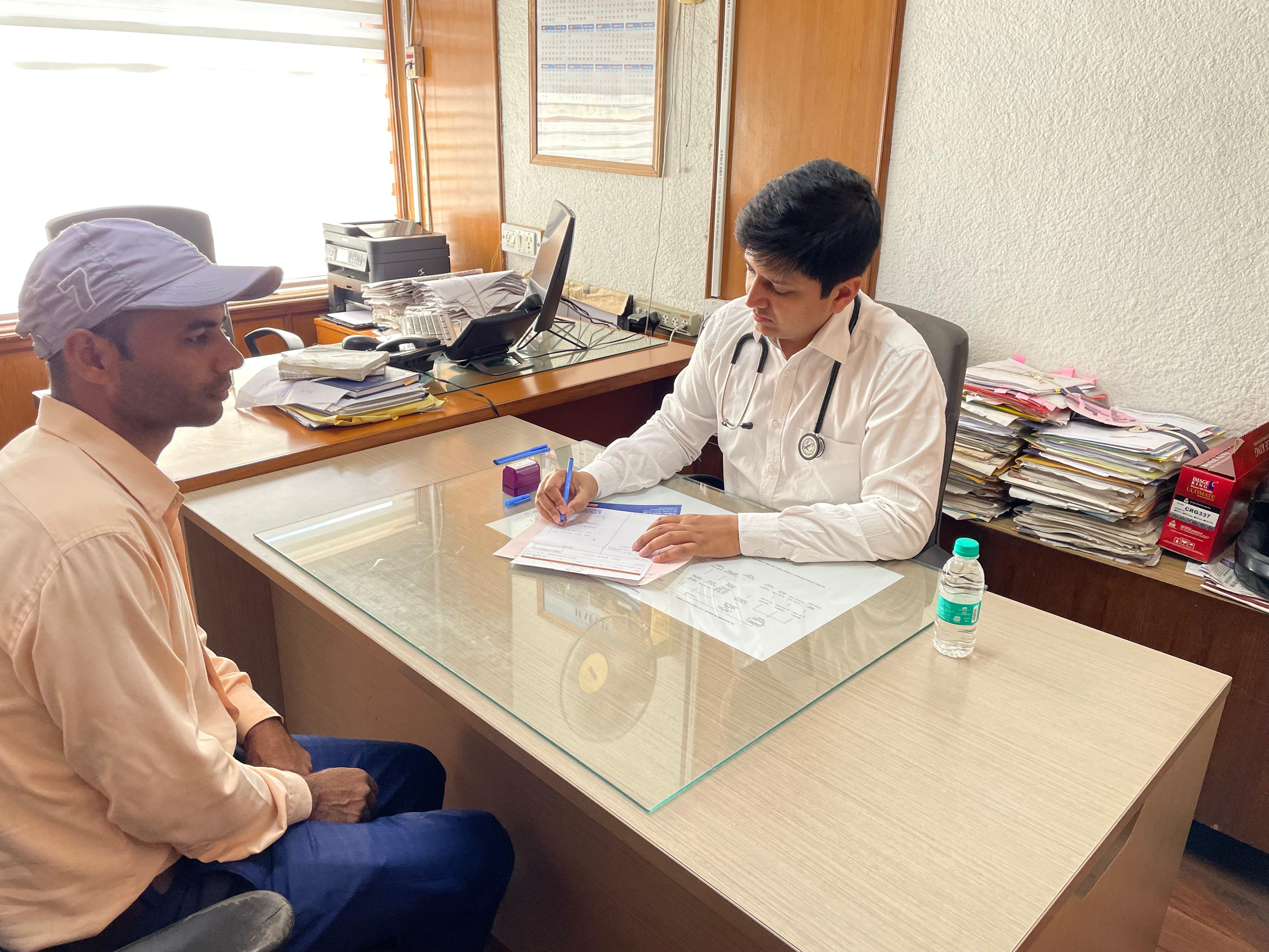 Dr. Aakash Aggarwal with patient